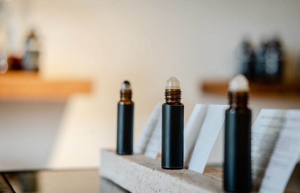 dark colored roller ball bottles standing up