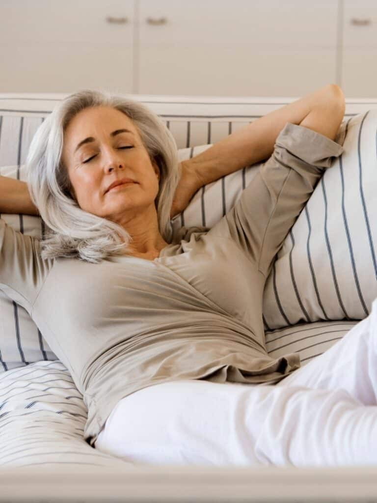 woman relaxing on a couch.