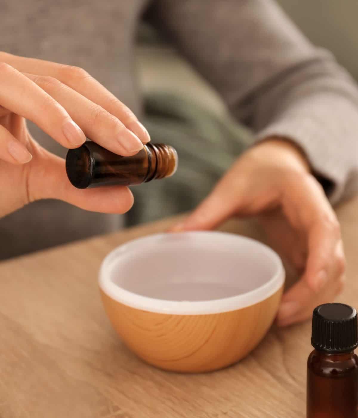Dropping essential oil into a 100 ml diffuser.