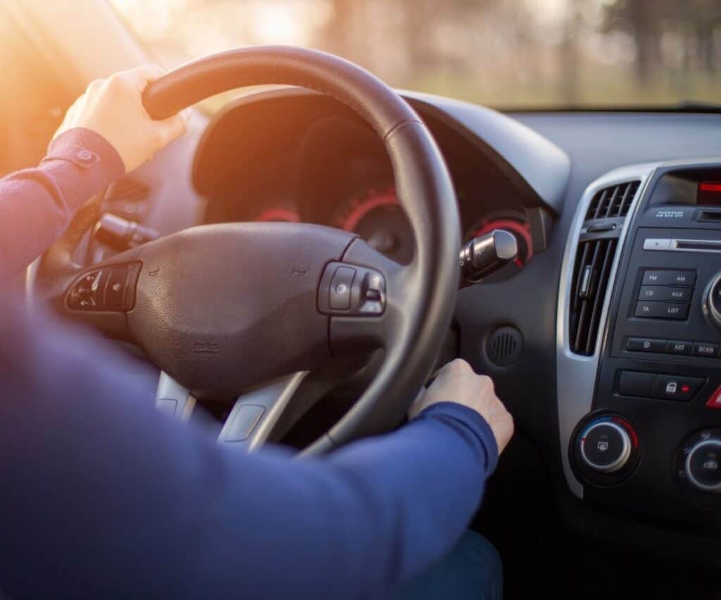 Male driving in a car with essential oil diffusing.