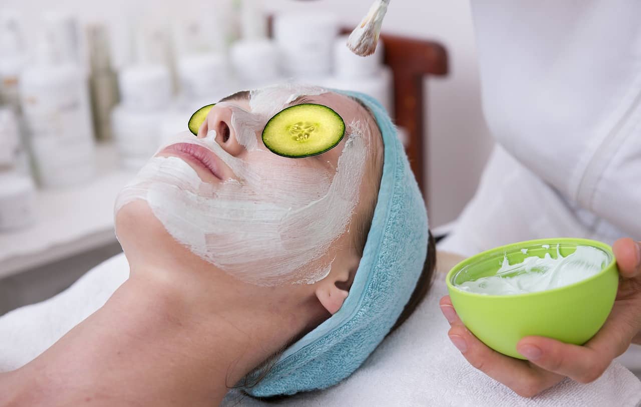 A woman at the spa getting a facial.