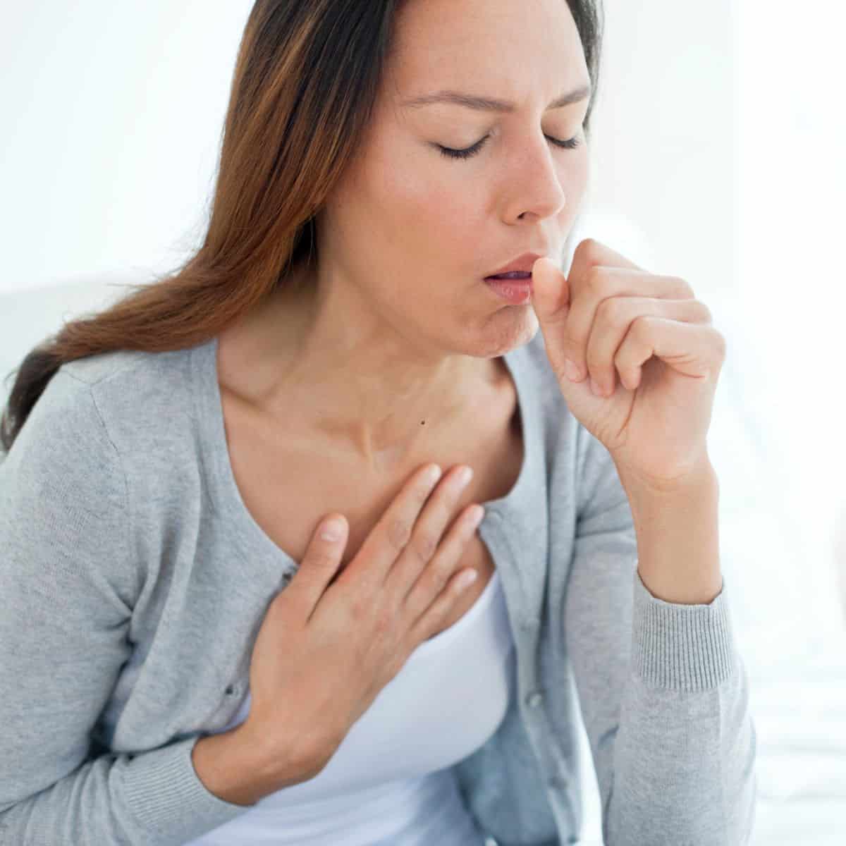 Woman coughing.