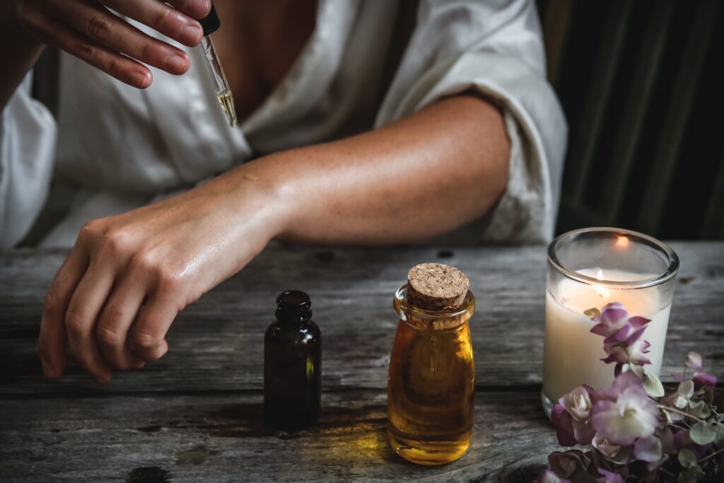 Applying essential oil topically.