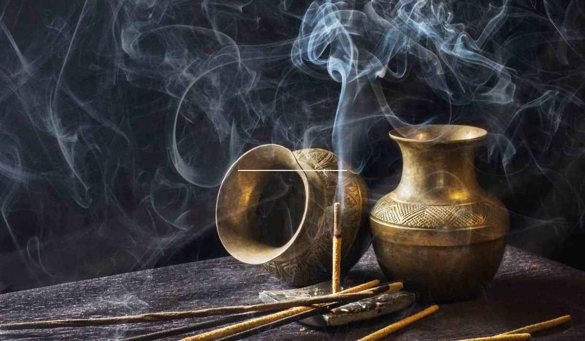 Lavender incense burning on table.